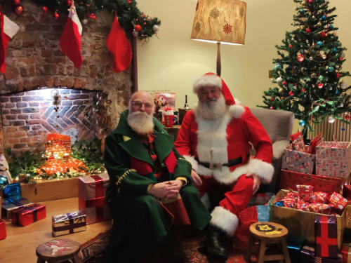 Santa and Ken the Elf; santa with child