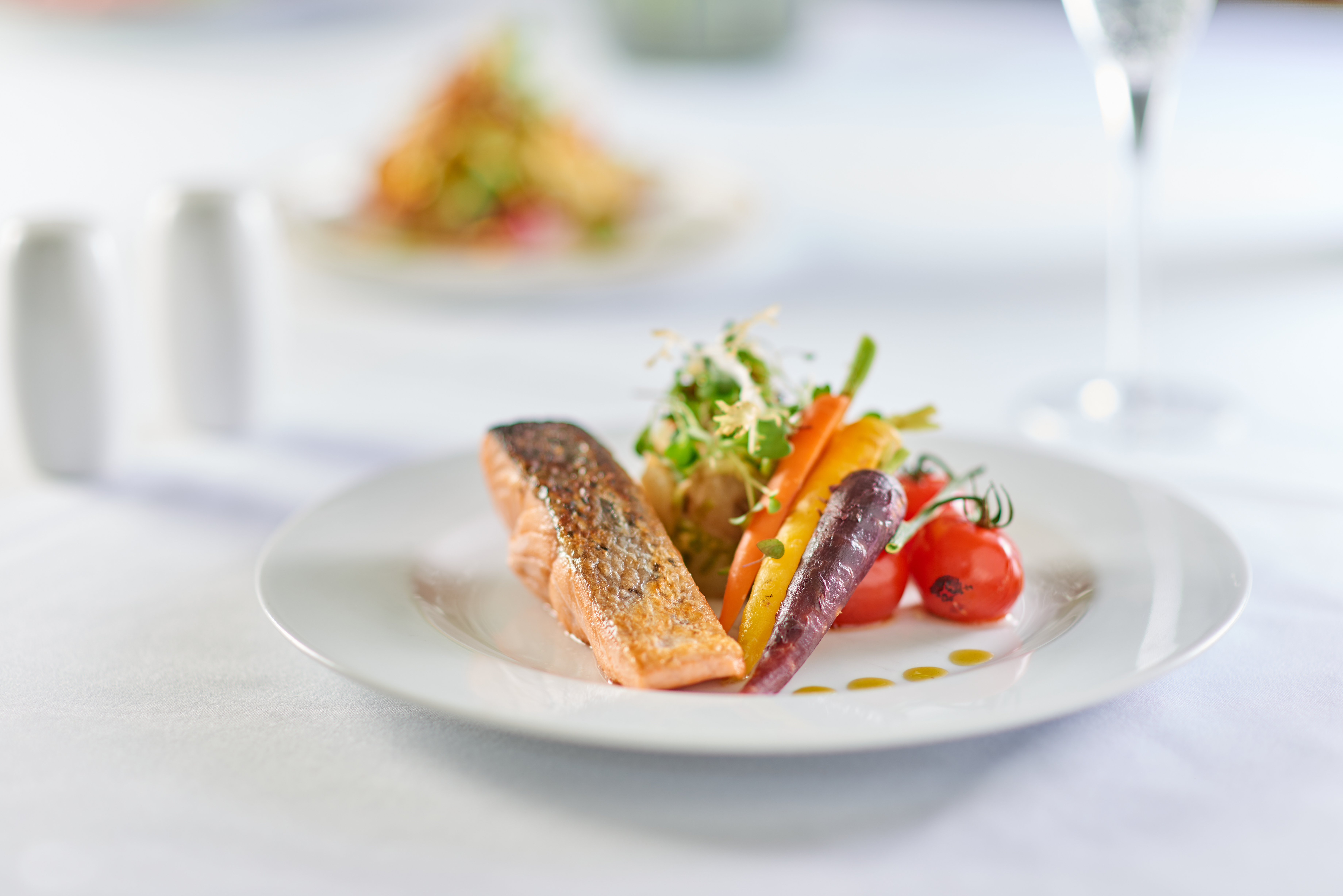  Pink Food's pan-fried salmon with zesty crushed new potatoes, heritage carrots and charred cherry tomatoes, salmon