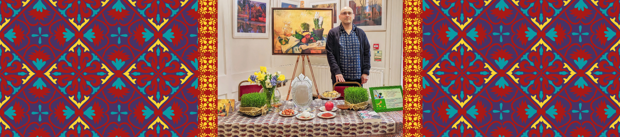 Curator Mehrdad with the Haft-sin display